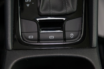  Three Black buttons for turning on and off the electronic system of vehicle stability control and...