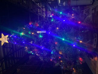Fototapeta na wymiar Brightly lit Christmas tree