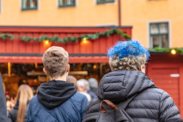  Teenagers with beautiful blue hair. with your back.