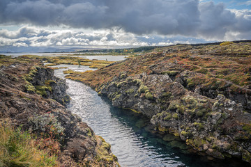 Þingvellir or Thingvellir national park in Iceland, is a site of historical, cultural, and geological significance, the fissure devides the tectonic plates of America and Eurasia