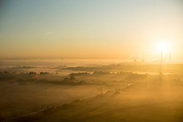 Misty morning and bright sunrise. High-altitude photography.