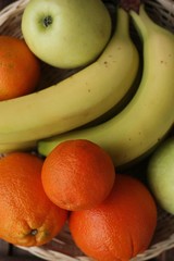 Oranges apples and bananas on the table 