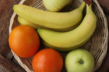 Oranges apples and bananas on the table 