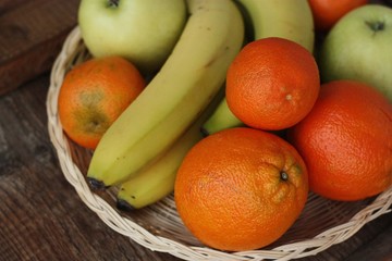 Oranges apples and bananas on the table 