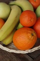 Oranges apples and bananas on the table 