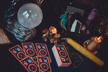 Magical scene, esoteric concept, fortune telling, tarot cards on a table  - obrazy, fototapety, plakaty