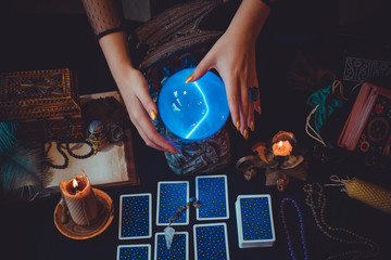 Magical scene, esoteric concept, fortune telling, tarot cards on a table 