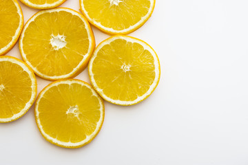 Fototapeta na wymiar Yellow oranges on white neutral background