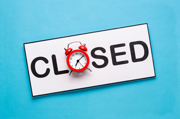 Closed sign with alarm clock and copy space