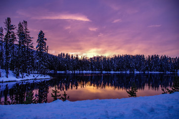 Winter Sunset on Snowy Forest Lake