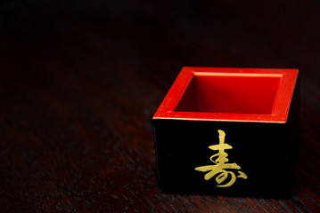box with ribbon on black background, asian food, japanese cuisine