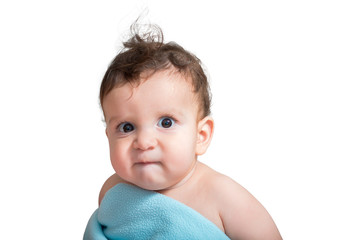 a 9 month baby boy biting his lip with an angry face like a little boss, isolated, covered in a...