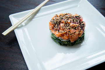 sunomonu in white dish hashi shoyo sauce raw salmon and sesame, asian food, japanese cuisine