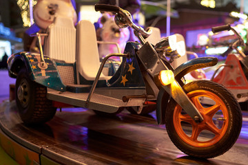 Vehicles on a children's carousel at a Christmas market in Wolfsburg