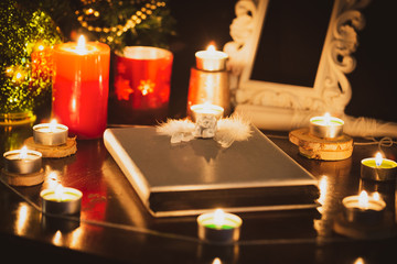 Fototapeta na wymiar Pictures of candles and books for ritual, mysticism and mysteries about superstition. Concept Divine magic & occultism