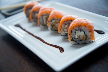 sushi with chopsticks isolated on white background, asian food, japanese cuisine