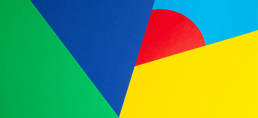 Abstract geometric shape yelllow, blue, red, green color paper background
