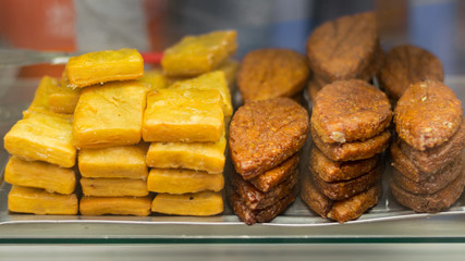 traditional south asian sweet displayed in local shop for sell in a glass container