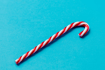 Christmas lollipop cane on blue background