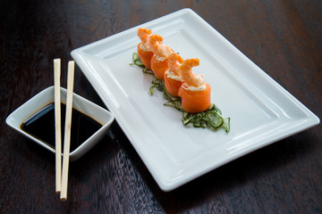 salmon cucumber and cream cheese shrimp sushi in a white plate shoyo and chopstick sauce, asian food, japanese cuisine