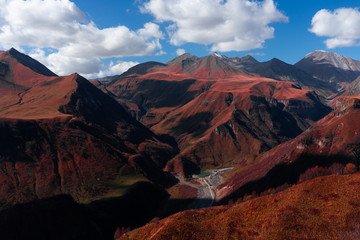 A panoramic view of Mount Kazbegi is a sleeping stratovolcano and one of the main mountains of the Caucasus, located on the border of the Kazbegi region of Georgia. In lush lava color. Design and crea