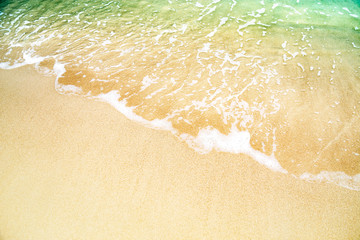 Sea waves on the sandy beach