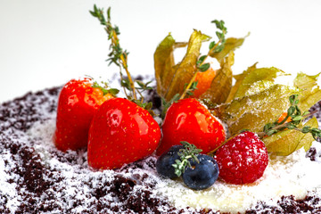 strawberries and blueberries on the cake