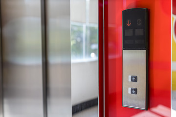 securing lift or elevator access control. elevator access control, Hand holding a key card to unlock elevator floor before up or down. 