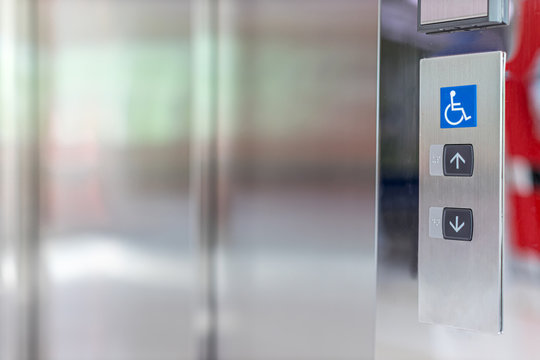 Image Of Disabled Lift Button. Stainless Steel Elevator Panel Push Buttons For Blind And Disability People. Push Button For The Disabled. Care And Technology. Elevator Buttons For Disabled People.