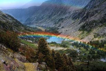 Fototapeta na wymiar rainbow over mountain valley