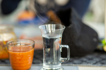 Hot tea water and smoothie in a cafe