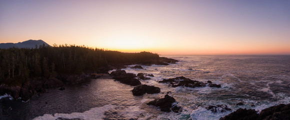 Ucluelet, Vancouver Island, British Columbia, Canada. Aerial Panoramic View of a Small Town near Tofino on a Rocky Pacific Ocean Coast during a cloudy  and colorful morning sunrise.