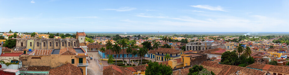 Fototapeta premium Aerial panoramic view of a small touristic Cuban Town during a sunny and cloudy summer day. Taken in Trinidad, Cuba.