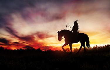 Indian of America on horseback at sunset © ginettigino