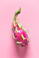 Creative flat layout with fresh organic pink, white and green dragonfruit (pitaya or pitahaya) on...