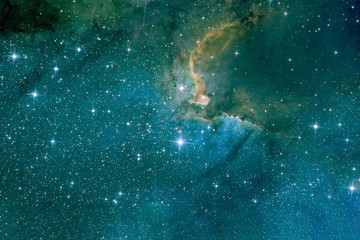 Beautiful blue nebula with stars. Background texture. Elements of this image were furnished by NASA.