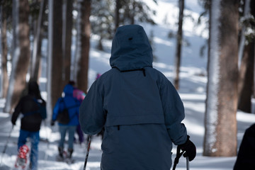 Snowshoe walker raquettes in powder snow Winter hiking