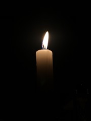 candle in the dark with a wick