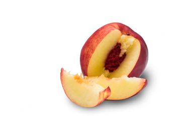 Ripe red nectarine and slices isolated on a white background