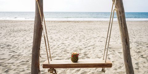 pineapple on the beach with cherry and lemon 
