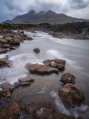 Rain over the Cuillin mountains makes the streams and rivers full of water