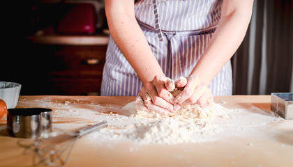 fingers on dough, chef kneads dough for baking, concept cooking, bakery