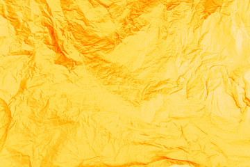 Yellow, orange, warm background. Creased paper texture.