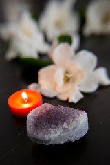 Fototapeta na wymiar Gardenia flowers, Amethyst, candle