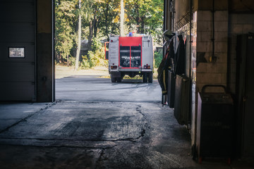 Fire engine leaving the garage of the fire station