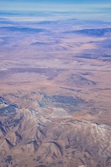 Colorado Rocky Mountains Aerial view from airplane of abstract Landscapes, peaks, canyons and rural cities in southwest Colorado and Utah. United States of America. USA.