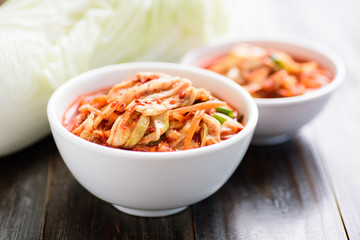 Kimchi cabbage in bowl on wooden background, Korean food