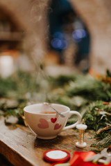 cup of hot tea on wooden table