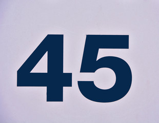 Fototapeta premium A house number plaque, showing the number fourty five (45)