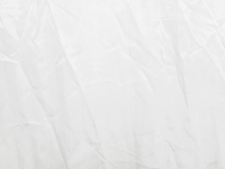 Soft white wrinkled fabric background